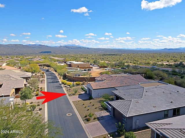 birds eye view of property with a mountain view