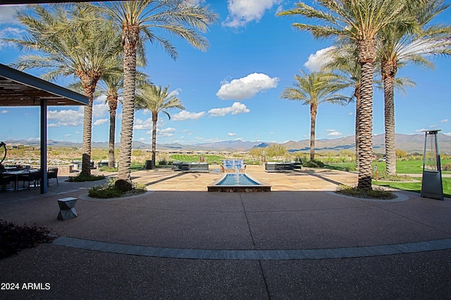 view of patio / terrace with a mountain view