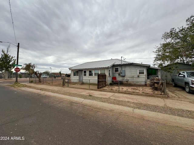 bungalow-style home with a fenced front yard