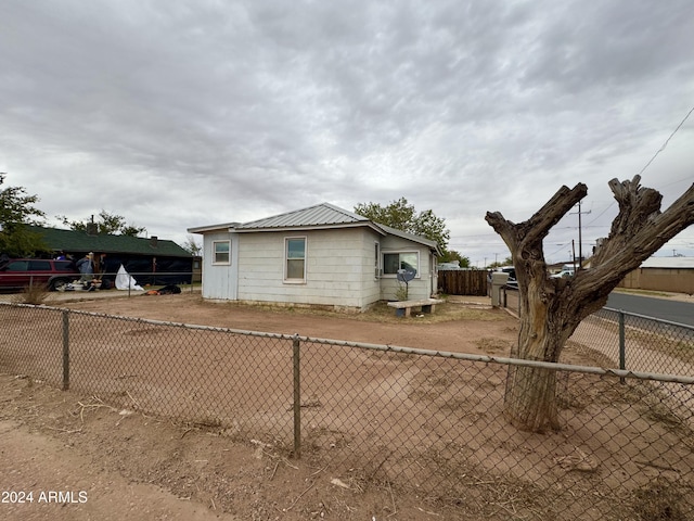 view of property exterior featuring a fenced backyard