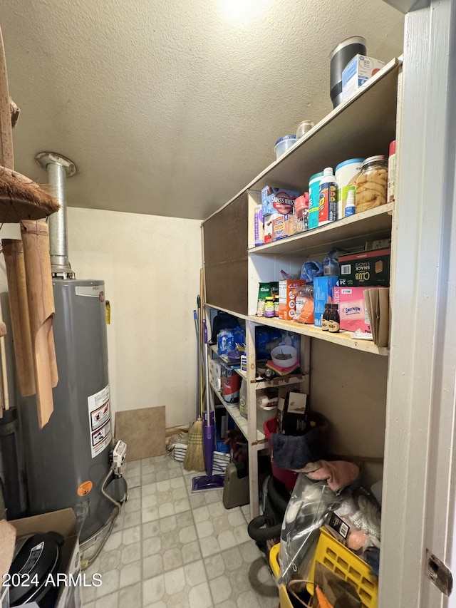 storage room featuring water heater