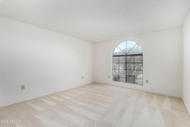 empty room with light colored carpet