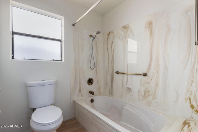 bathroom featuring hardwood / wood-style floors, shower / tub combination, and toilet