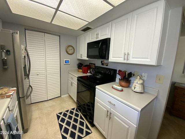 kitchen featuring white cabinets and black appliances