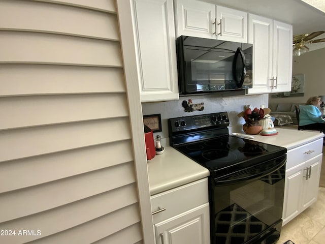 kitchen featuring ceiling fan, white cabinets, and black appliances