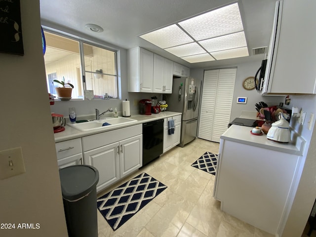 kitchen featuring white cabinets, sink, and stainless steel appliances