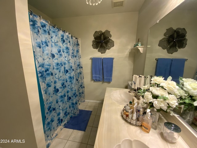 bathroom with tile patterned flooring, vanity, and a shower with shower curtain