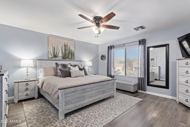 bedroom with dark wood-type flooring and ceiling fan