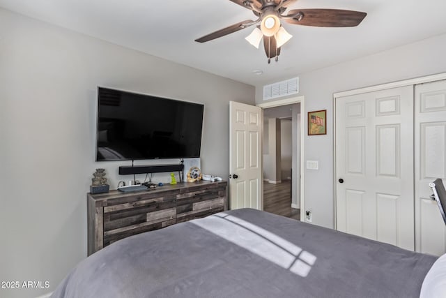 bedroom with ceiling fan and a closet