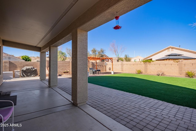 view of patio featuring a grill