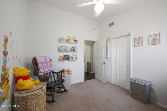 bedroom featuring visible vents, light carpet, ensuite bathroom, a ceiling fan, and vaulted ceiling