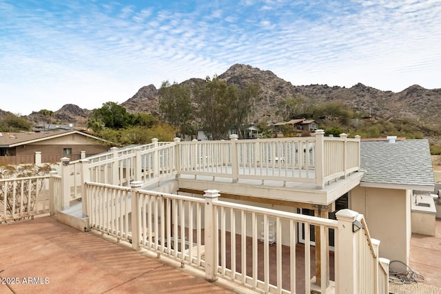 wooden deck with a mountain view