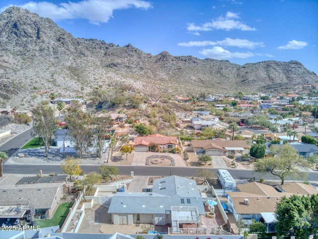 drone / aerial view featuring a residential view and a mountain view