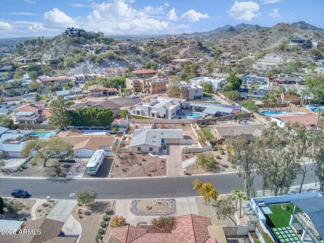 drone / aerial view featuring a residential view and a mountain view