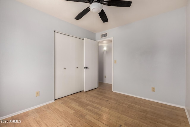 5135 E Evergreen St Unit 1166, Mesa, AZ 85205 - unfurnished bedroom featuring light wood-style floors, a closet, and baseboards