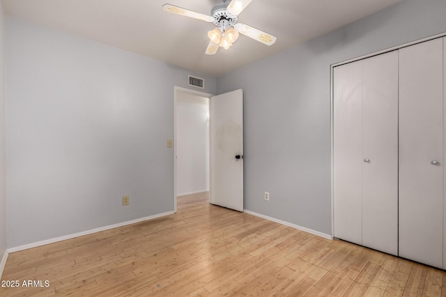 5135 E Evergreen St Unit 1166, Mesa, AZ 85205 - unfurnished bedroom featuring wood finished floors, baseboards, a closet, and ceiling fan