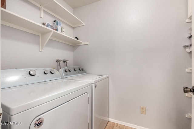 5135 E Evergreen St Unit 1166, Mesa, AZ 85205 - washroom with washing machine and clothes dryer, light wood-style flooring, and baseboards