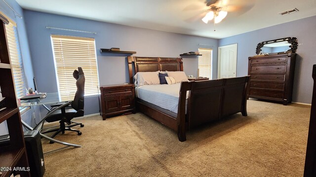 carpeted bedroom with ceiling fan