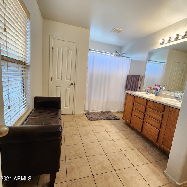 bathroom with vanity and tile patterned flooring