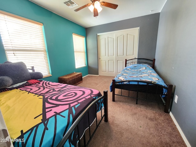 6349 W Valencia Dr, Laveen, AZ 85339 - bedroom with carpet flooring, a closet, and ceiling fan
