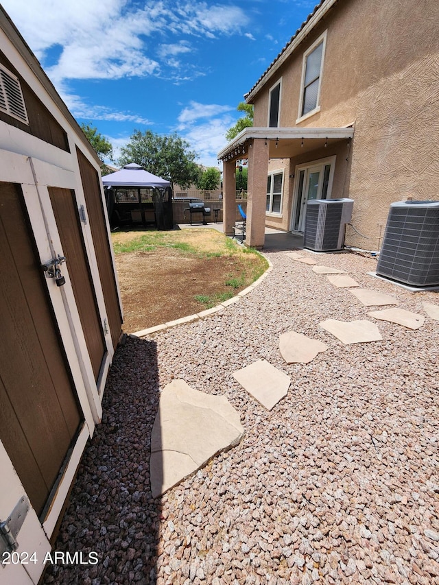 6349 W Valencia Dr, Laveen, AZ 85339 - view of yard featuring a gazebo and central air condition unit