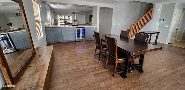 6349 W Valencia Dr, Laveen, AZ 85339 - dining space featuring bar area, light wood-type flooring, and wine cooler