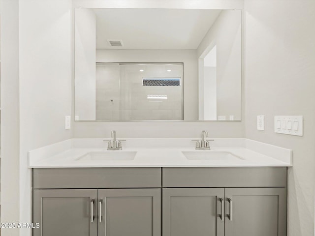 bathroom with vanity and an enclosed shower