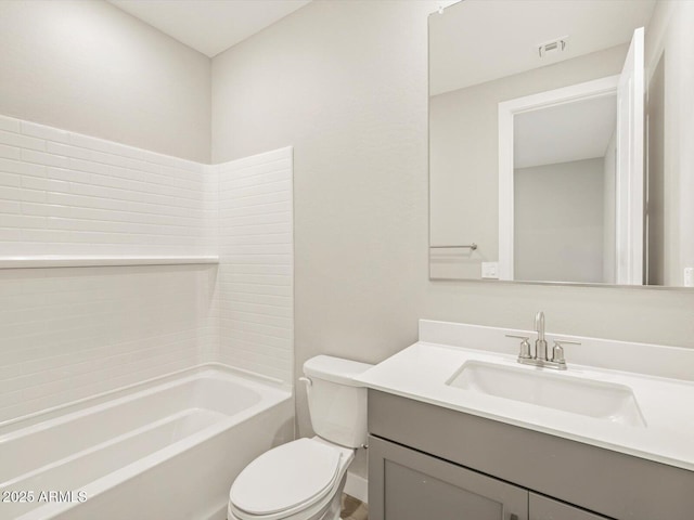 full bathroom with vanity, washtub / shower combination, and toilet