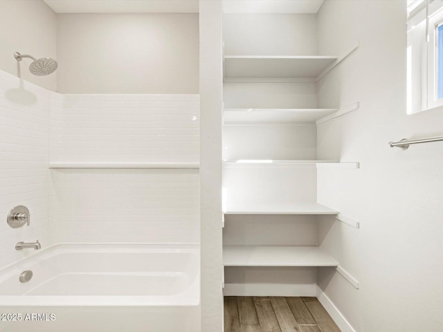 bathroom featuring shower / bathtub combination and wood-type flooring