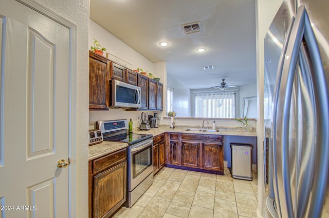 kitchen featuring visible vents, ceiling fan, a sink, and appliances with stainless steel finishes