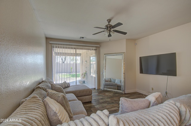 living room with wood finished floors, ceiling fan, baseboards, and visible vents