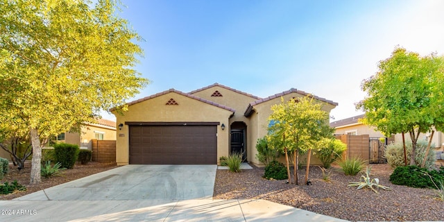 mediterranean / spanish-style house featuring a garage