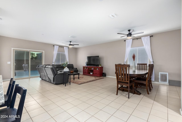 tiled dining area with ceiling fan