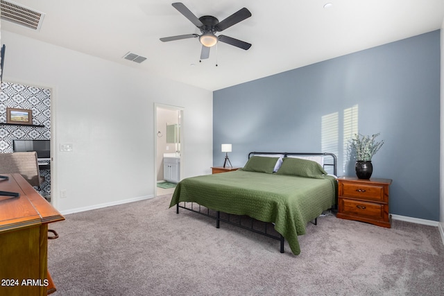 carpeted bedroom with connected bathroom and ceiling fan