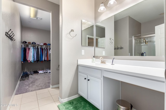 bathroom with vanity, tile patterned floors, and an enclosed shower