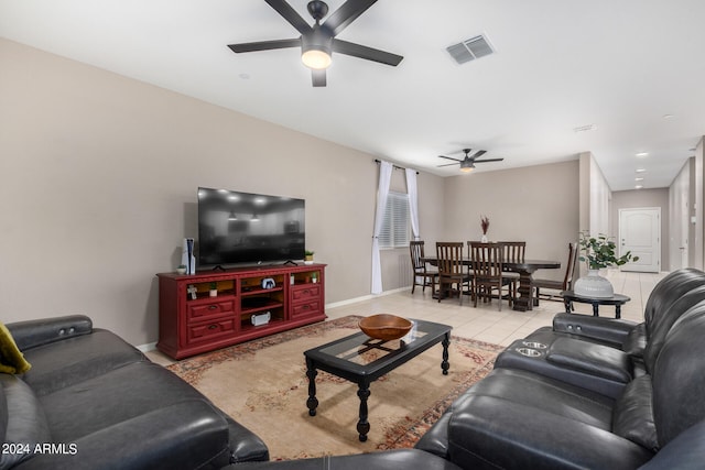 living room with ceiling fan and light tile patterned floors