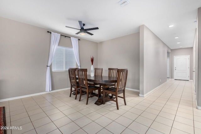 tiled dining room with ceiling fan