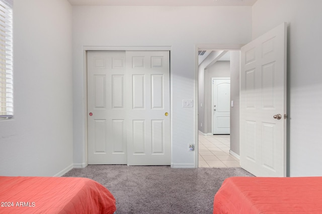 carpeted bedroom featuring a closet