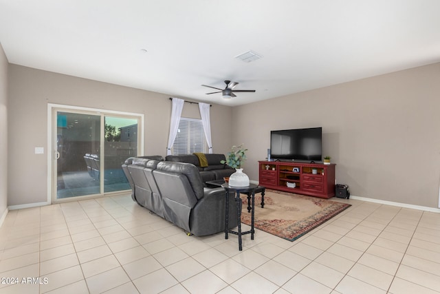 tiled living room with ceiling fan