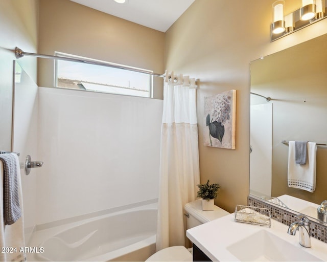 full bathroom with vanity, toilet, and shower / tub combo with curtain