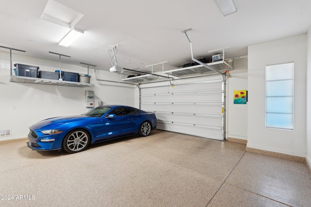 garage featuring a garage door opener