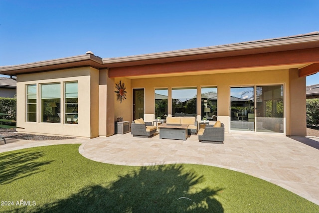 back of property with a patio and an outdoor hangout area