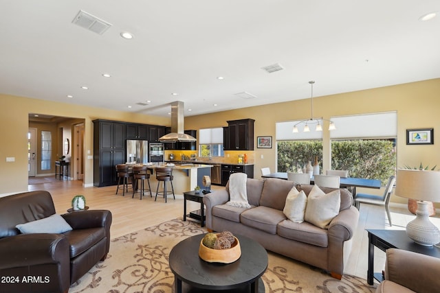 living room with light hardwood / wood-style flooring