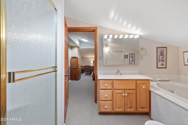 bathroom with lofted ceiling, a textured ceiling, independent shower and bath, and vanity