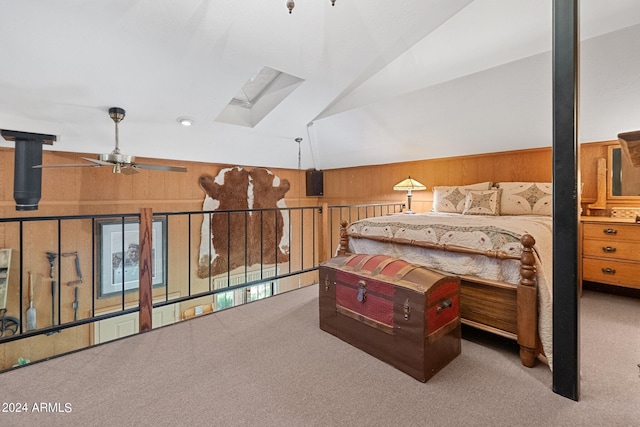 bedroom featuring a skylight, carpet flooring, and high vaulted ceiling