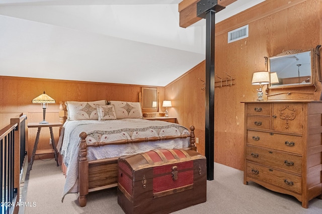 carpeted bedroom with wooden walls and a wood stove