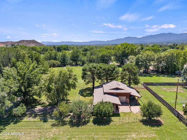 birds eye view of property featuring a mountain view and a rural view