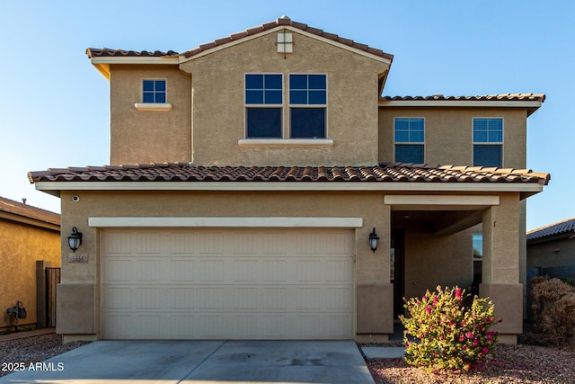 mediterranean / spanish home featuring a garage