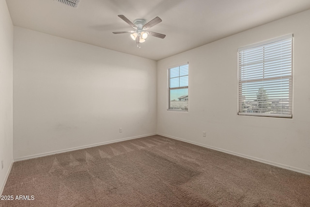 unfurnished room featuring carpet flooring and ceiling fan