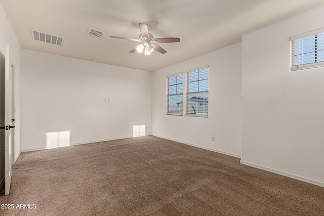 empty room featuring carpet flooring and ceiling fan